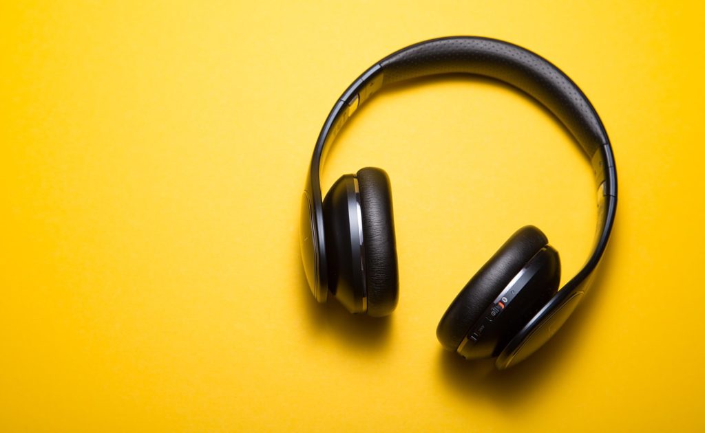 Headphones against a yellow background